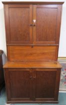 A 20th century beech secretary cabinet with two doors above fall front above two further doors 191cm