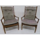 A pair of mid 20th century teak framed Parker Knoll armchairs (2) Condition report: Available upon