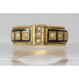 A 15ct gold mourning ring with hair panels, black enamel and pearls, hallmarked Chester 1897, size