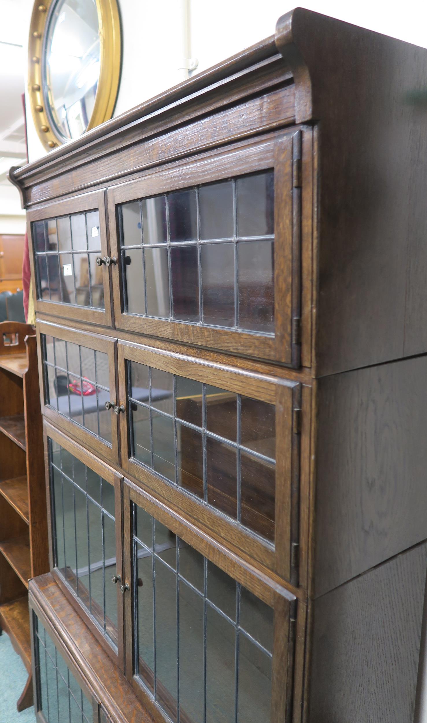 An early 20th century Minty Limited oak sectional bookcase with leaded glass doors 157cm high x 90cm - Image 2 of 3