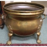 A 19th century brass planter on lion's paw feet Condition report: