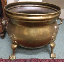 A 19th century brass planter on lion's paw feet Condition report: