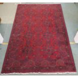 A red ground Khan Mohamadi rug 200cm long x 127cm wide Condition report: Available upon request
