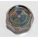 A Perthshire millefiori paperweight with a millefiori canopy in alternating cane groups separated by