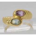 An 18k gold purple and aqua coloured gem set ring, size L1/2, weight 3.9gms Condition report: