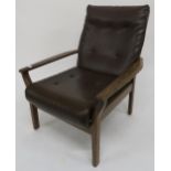 A mid 20th century Cintique teak framed armchair with brown vinyl upholstery Condition report: