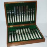 A cased twelve piece silver & mother of pearl handled dessert cutlery set, Sheffield 1919