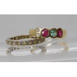 A yellow metal ruby, emerald and diamond dress ring size N1/2, together with a 9ct clear gem set