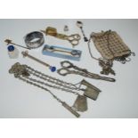 A lot comprising a white-metal chatelaine, part baby rattle, grape scissors, snuffers, bangle etc