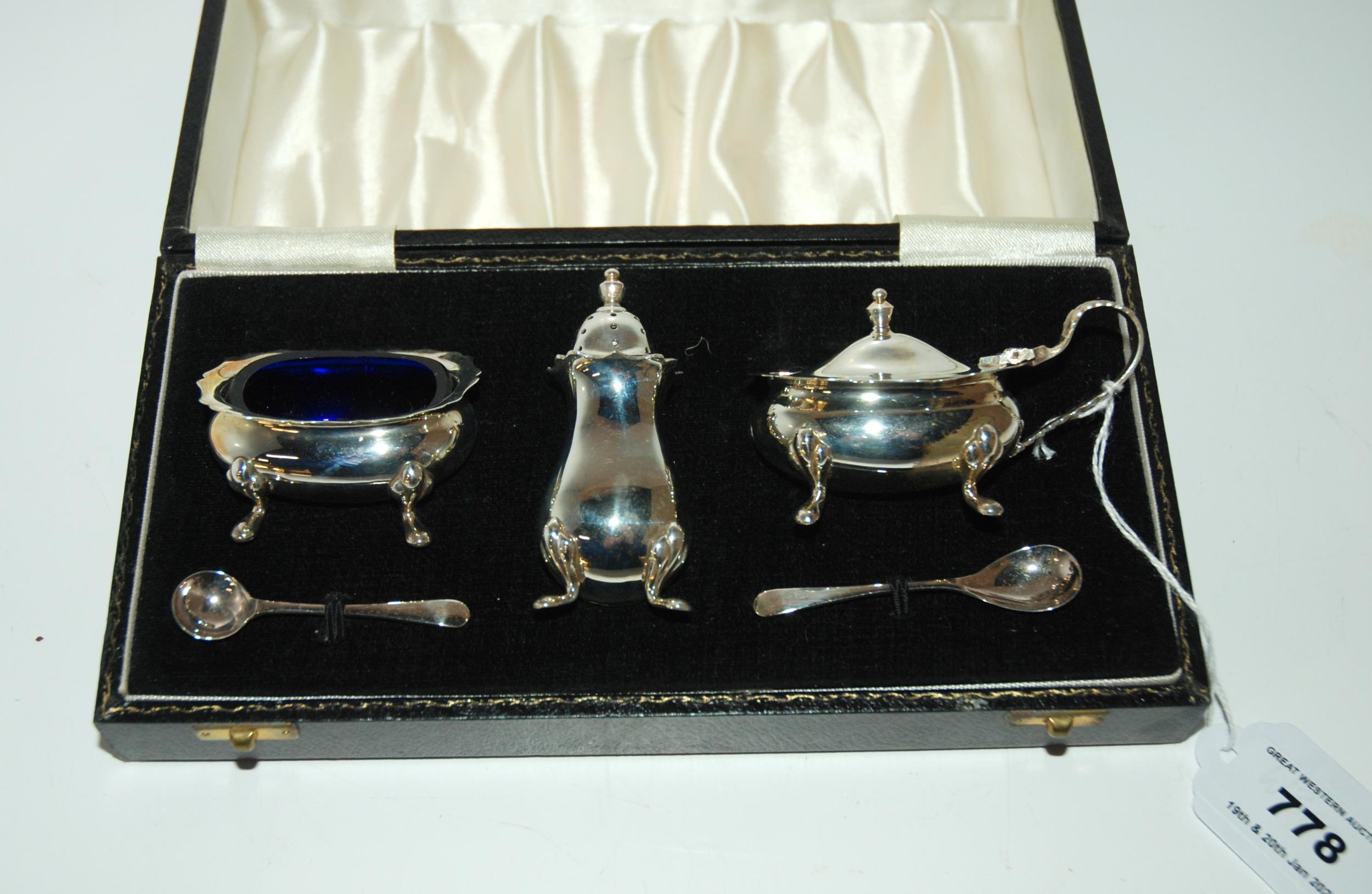 A cased three piece silver condiment set, Birmingham 1981 Condition report: Available upon request