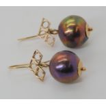 A pair of large black pearl earrings mounted in yellow metal diameter of the pearls approx 14.5mm,