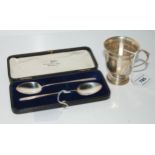 A lot comprising a silver christening mug, Birmingham 1910, 7.5 cm high & a cased pair of silver jam