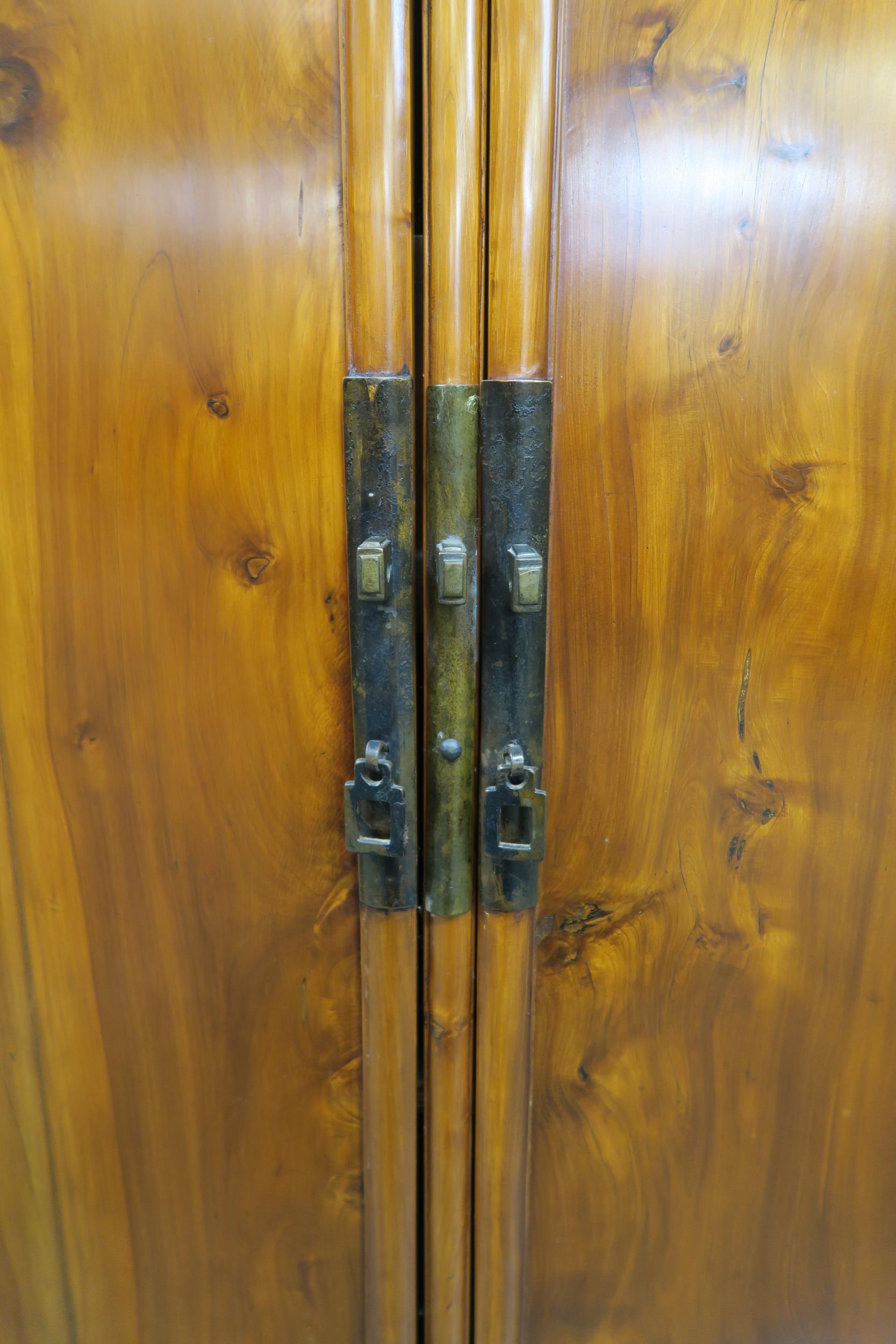 An early 20th century Chinese hardwood two door cabinet with two internal drawers 112cm high x - Image 2 of 4