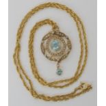 A 9ct gold Edwardian blue zircon and pearl pendant with a yellow metal rope chain, weight combined