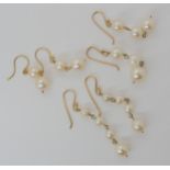 Three pairs of pearl drop earrings with yellow metal mounts Condition report: Available upon