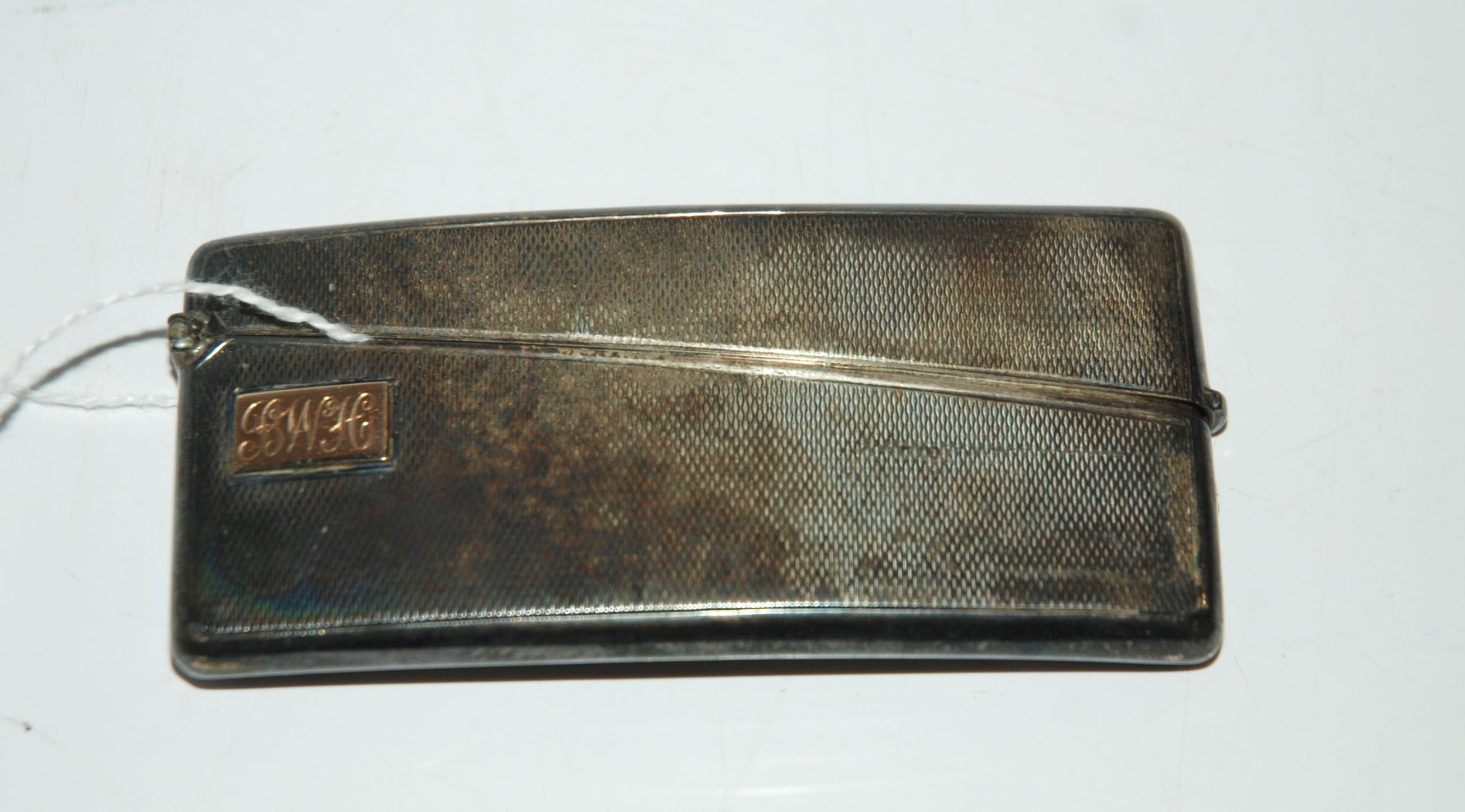 A silver card case London 1935 rectangular curved body with engine turned decoration monogrammed "