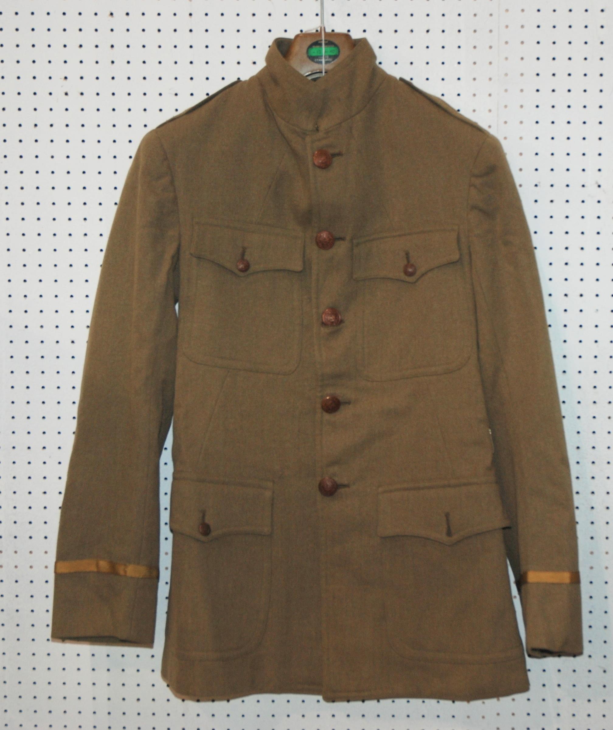 An army tunic, leather gaiters and shell cases Condition report: Available upon request