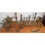 An assorted lot of brass candle sticks, trivets,Henry & Sons Wolverhampton, watering can,