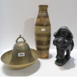 A carved inuit figure of a mother and baby, a brass bell (no clapper), a brass dish and a studio