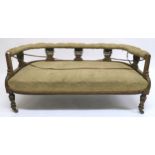 A Victorian mahogany framed parlour settee on turned supports, 60cm high x 139cm wide x 60cm deep