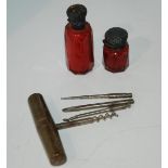 A box of miscellaneous including cranberry glass scent bottles, novelty corkscrew and other