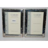 A lot comprising two cased silver-moulted photo frames by Carrs Sheffield, 18.5 x 13cm and 14.8 x