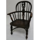 A 19th century elm Windsor child's chair, 64cm high x 45cm wide x 41cm deep Condition report: