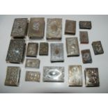 A lot comprising nineteen assorted silver matchbox holders with embossed decoration various makers