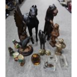 A lot comprising a leather figure of a horse, a smaller spelter example, a carved wooden figure of a
