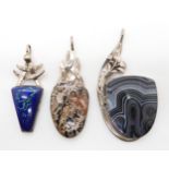 Three signed pendants by the American designer Jeweller Tom Burns of Vermont, white metal mounts
