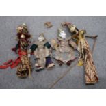 A collection of vintage Thai wooden hand puppets wearing gilt and embroidered garments Not available