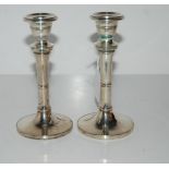 A pair of silver candlesticks, rubbed marks, 15.5cm high, weighted Condition report: Available