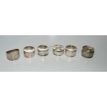 A lot comprising six assorted silver napkins rings, 132 grams Condition report: Available upon