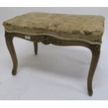 A 20th century walnut framed footstool with tapestry upholstered seat, 47cm high x 66cm wide x