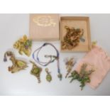 Two large fairy brooches, other fairy items, a large unicorn, and cat pendants, some with boxes A