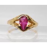 A bright yellow ring set with a glass filled ruby, finger size T, weight 5gms Ruby nice but
