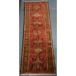 A terracotta ground Karajeh runner, 200cm long x 70cm wide Condition report: Available upon request