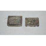 A lot comprising two silver pill boxes one with engraved decoration 4.5 x 3.5cm, the other with