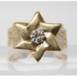 A Star shaped gents ring set with an estimated approx 0.40ct brilliant cut diamond, finger size Y1/