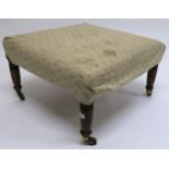 A Victorian mahogany framed upholstered footstool with turned supports 39cm high x 67cm wide x