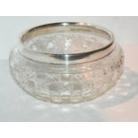 A cut glass fruit bowl with silver rim mount, London 1925, 23cm diameter Condition report: Available