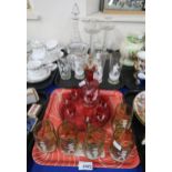 A Mary Gregory cranberry glass liquor set, five Mary Gregory yellow glass cups, four similar