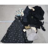 A lot comprising a vintage ladies black dress with bow, two waistcoats, mens striped trousers, a