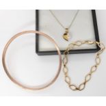 A 9ct rose gold bangle, inner diameter 7cm, a 9ct gold fancy link bracelet, a very fine 9ct chain