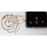 Four boxed 9ct shirt studs, two pairs of yellow metal facet stud earrings, three chains, two