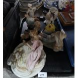 A lot comprising a Nao owl, a Lladro figure of a reclining boy, a Capodimonte lady with a mirror,