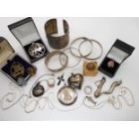 Two Shetland silver pendants, an Italian made faux coin pendant, chains, bangles etc A condition