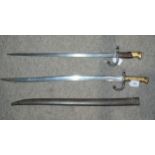 A French bayonet, the blade inscribed, the guard and metal scabbard numbered AC 47793 and another,