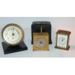 A miniature travel alarm clock in fitted case, 5cm wide (af), a miniature carriage clock and a