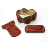 A collection of Cinnabar items to include a bracelet, and two brooches Condition Report:Condition